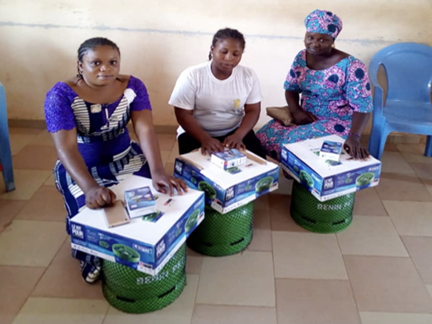 Women beneficiaries receiving gas kits