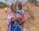 Kenya Kuku woman in grass seed bank